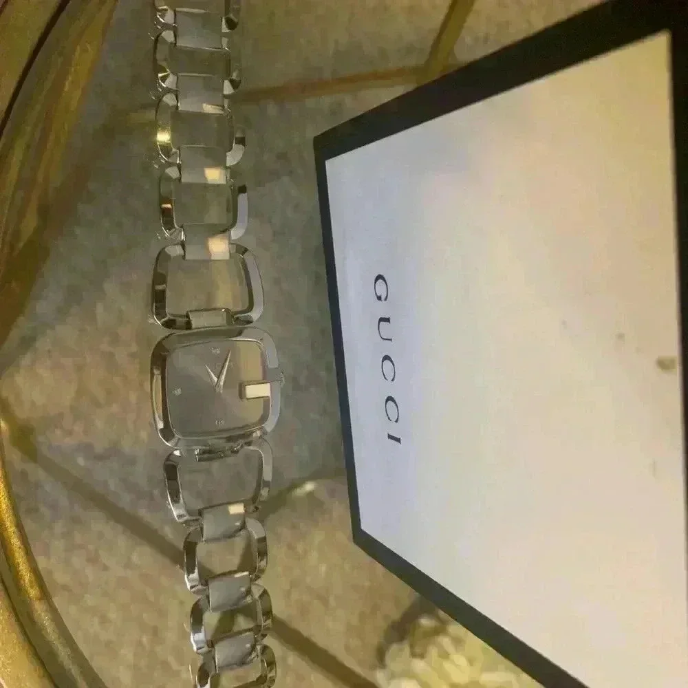 Gucci G watch Silver with Dark Bronze Face With Diamonds.